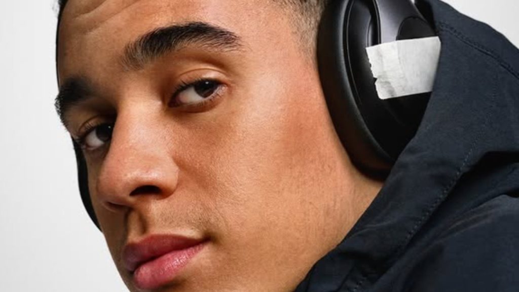 Musiala with Beat headphones covered up